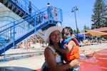 Four-year-old Kai cools off with mom Elizabeth Banderas at Juniper Swim and Fitness Center in Bend on June 30, 2021. "I'm still telling [my kids] we still need to keep a safe distance and let's not give people that we don't know hugs," Banderas said.