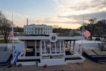 Workers continue with the finishing touches on the presidential reviewing stand on Pennsylvania outside the White House Thursday, Jan. 16, 2025, in Washington, ahead of President-elect Donald Trump's inauguration. (Jon Elswick via AP)