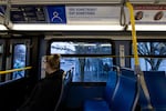 A sign on a TriMet bus from Tigard, Oregon, to downtown Portland urges passengers to call emergency services in cases of unsafe situations.