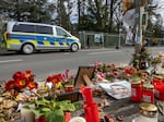 Flowers and candles are laid in front of the Russian Consulate General in memory of Alexei Navalny, in Bonn, Germany, on Sunday.