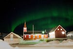 Northern Lights over the Church of Our Saviour in Nuuk, Greenland, Saturday Feb. 21, 2026. (Bo Amstrup/Ritzau Scanpix via AP)