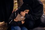 Relatives of Amal Hassan al-Durr, the 5-year-old girl killed in an Israeli airstrike, mourn her loss at the graveyard in southern Lebanon.