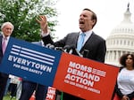 Sen. Chris Murphy, D-Conn., addresses a rally with fellow Senate Democrats and gun control advocacy groups outside the U.S. Capitol on Thursday. Organized by Moms Demand Action, Everytown for Gun Safety and Students Demand Action, the rally brought together members of Congress and gun violence survivors to demand gun safety legislation following mass shootings in Buffalo, N.Y., and Uvalde, Texas.