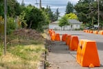 Barricades line Kenny Housman's property, on Clinton Street near the intersection with Southeast 136th Avenue in Portland, July 9, 2025. Housman allowed people living in RVs and other vehicles to park along his property, which developed into an ad hoc encampment that drew headlines.