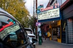 People walk past the century old Cinema 21 in Portland, Ore., Oct. 22, 2025.