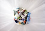 Containers holding liquids and gels that were taken from passengers lie in a trash can at Dulles International Airport near Washington, D.C., on Aug. 10, 2006.