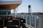 Seats sit empty during lunch hour at a restaurant at The Waterfront Vancouver, in Vancouver, Wash., on March 16. Taxes that governments would have collected on dining and many other aspects of the economy are projected to take a hit.