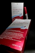 FILE - This July 18, 2014, file photo shows AbbVie's signature drug Humira, in Houston. Humira is one of the most commonly prescribed specialty medications used to treat autoimmune disorders.