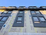 An apartment building under construction in Olympia, Washington in January 2025. Critics of a proposal to cap rent increases in Washington argue that it could stifle new development.