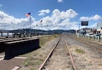 Railroad tracks run alongside the waterfront in downtown Coos Bay, Ore. on Sept. 15, 2024.