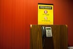 A phone to call a problem gambling hotline is pictured at the Wildhorse Resort and Casino in Pendleton, Ore., Friday, Jan. 11, 2019.