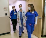 (Left to right) Clinical nurse Heather Gatchet, Dr. Peter Hakim, and emergency room nurse manager Nancy Bee head into the emergency department at Salem Health in this file photo from Jan. 27, 2022. 