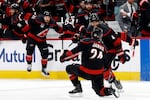 Carolina Hurricanes' Seth Jarvis (24) celebrates after his winning goal with Shayne Gostisbehere (4) during the overtime period in Game 2 of the NHL hockey Stanley Cup Final series against the Vegas Golden Knights in Raleigh, N.C., Thursday, June 4, 2026.