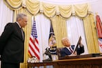 David Sacks, the White House 'czar' for artificial intelligence policy, speaks to President Trump as he signs a series of executive orders in the Oval Office on Jan. 23, 2025.