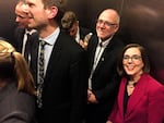 Oregon Gov. Kate Brown and her husband, Dan Little, are all smiles in an elevator after her victory over Republican state Rep. Knute Buehler in the hotly contested governor's race.