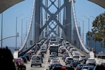 Full lanes of cars crossing the Oakland San Francisco Bay Bridge.
