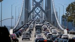 Full lanes of cars crossing the Oakland San Francisco Bay Bridge.
