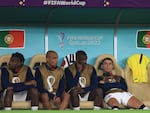 Cristiano Ronaldo of Portugal (R) reacts on the bench during the 2022 World Cup quarterfinal match against Morocco on December 10, 2022 in Doha, Qatar.