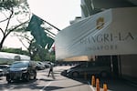 A man walk near the entrance of the Shangri-La Hotel, the venue for the International Institute for Strategic Studies (IISS) Shangri-La Dialogue, Asia's annual defense and security forum, in Singapore, Thursday, May 28, 2026.