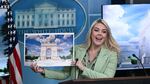 White House press secretary Karoline Leavitt shows a rendering of the planned triumphal arch to be added to Washington, D.C.'s National Mall as the Secretary of the Treasury, Scott Bessent, looks on at a meeting on Wednesday.