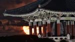 The full moon rises behind the Korean Bell of Friendship pavilion in Angel's Gate Park in Los Angeles.