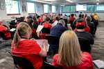About 40 people sit or stand quietly in attendance of the Woodburn Education Association and Woodburn School District's bargaining session at the district office on Oct. 16, 2025. 