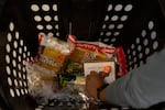 Jennee Edwards shops for special ingredients for ramen and a birthday card for her wife on Apr. 24, 2025 in Bend, Ore. Edwards says there's always something she finds that she suddenly needs during her shopping trips at Tomi Mart.