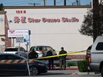 Investigators work at the scene of Saturday's mass shooting in Monterey Park, California.