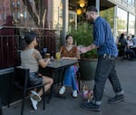 Pendleton City Councilor Addison Schulberg waits on customers at the Great Pacific Wine & Coffee Co. on Pendleton's Main Street on May 3, 2026.
