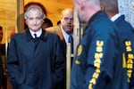 FILE - Disgraced financier Bernard Madoff leaves U.S. District Court in Manhattan after a bail hearing in New York, Monday, Jan. 5, 2009. Madoff, the financier who pleaded guilty to orchestrating the largest Ponzi scheme in history, died early Wednesday, April 14, 2021,  in a federal prison, a person familiar with the matter told The Associated Press.