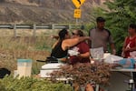 Melissa Howtopat, left, hugs a friend in Klickitat County on Aug. 19, 2022. Howtopat and her husband are raising questions about the Klickitat County Jail after their son died while enduring fentanyl withdrawal.