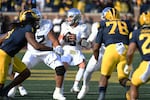 Oregon quarterback Dillon Gabriel (8) looks to pass against Michigan in the first half of an NCAA college football game, Saturday, Nov. 2, 2024, in Ann Arbor, Mich.