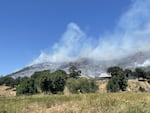 The Upper Applegate Fire has grown to over 300 acres in Southern Oregon. In this photo posted to Facebook on Wednesday, June 18, 2025, smoke can be seen rising from the fire in Jackson County. 