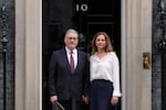 Britain's Prime Minister Keir Starmer and wife Victoria stand in front of 10 Downing Street door after speaking to the media in London, Monday, June 22, 2026.