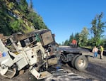 A blown tire on a truck carrying a crane Monday, June 27, 2022, led to a crash that closed a long section of I-84 between Hood River and Troutdale, according to Oregon State Police. The truck later caught fire but the driver reportedly escaped with minor injuries.