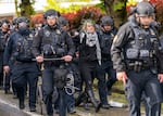 Law enforcement teams clear protesters from Portland State University’s Branford Price Millar Library, May 2, 2024. Demonstrators protesting the war in Gaza have occupied the library since Monday evening.