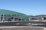 Southwest Oregon Regional Airport's terminal, built in 2008, overlooks the McCullough Memorial Bridge in North Bend. The airport district plans to expand the building in the future. Oct. 15, 2026.
