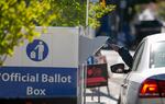 A voter drops off a ballot at the Multnomah County election office in Portland, Ore., November 2, 2020. Kristyna Wentz-Graff / OPB