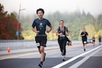 Yusaku Ajiro runs over the Sellwood Bridge during the Portland Marathon in Portland, Ore., Sunday, Oct. 6, 2019. The marathon's new route traveled through the Sellwood neighborhood.