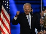 TOPSHOT - US President-elect Joe Biden holds up his fist after delivering remarks in Wilmington, Delaware, on November 7, 2020, after being declared the winners of the presidential election. (Photo by Jim WATSON / AFP) (Photo by JIM WATSON/AFP via Getty Images)