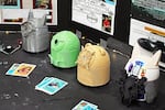 Hoy’s Sabe, or Bigfoot, SkoBot on display (right), alongside three other SkoBots that Boyer brought with her to show off at the STEAM Museum. Each represents a specific animal, such as the wolf, turtle and bear. Hoy’s SkoBot is 3D printed in light grey, and its face is adorned with a footprint surrounded by floral designs.