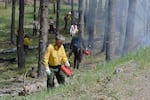Landowner Ron Schaaf led the firing team on the first pass across the top of the property while a holding crew monitored in the background.
