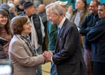 U.S. Rep. Suzanne Bonamici, left, talks with Portland mayor-elect Keith Wilson shakes hands following his official acceptance speech Thursday, at the Charles Jordan Community Center in Portland, Ore., Nov. 7, 2024. 