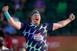 Ryan Crouser celebrates after setting a world record during the finals of men's shot put at the U.S. Olympic Track and Field Trials on Friday, June 18, 2021, in Eugene.