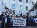 Dozens of Portlanders rally for clean air at the state capitol building after delivering a petition to Gov. Kate Brown.