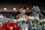 Stuffed animals mark a makeshift memorial during a candlelight vigil at Drake Park after three children and a teacher were killed in a shooting at Silver Rail Elementary School in Bend, Ore. on Oct. 15, 2026. 