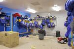 A trash barrel sits in the middle of an outdated locker room at Gervais High School. 