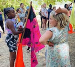 Campers at Courageous Kids camp designed personalized flags for their units and presented them to the whole camp.