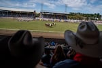 Attendees watch the bareback competition at the Pendleton Roundup Grandstand in Pendleton, Ore., on Friday.