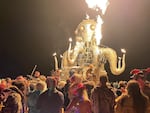 Attendees dance during the annual Burning Man Festival in the early morning of Sept. 5, 2023. Thousands of revelers were stuck in the mud for days last year.